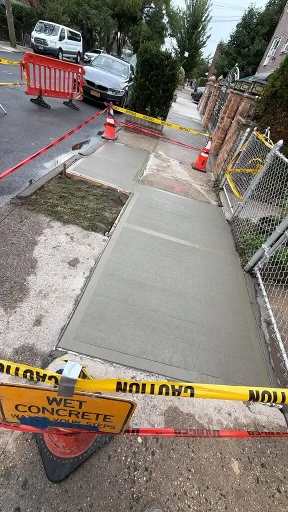 Replaced concrete sidewalk slabs at a home on Matthews Ave in the Bronx