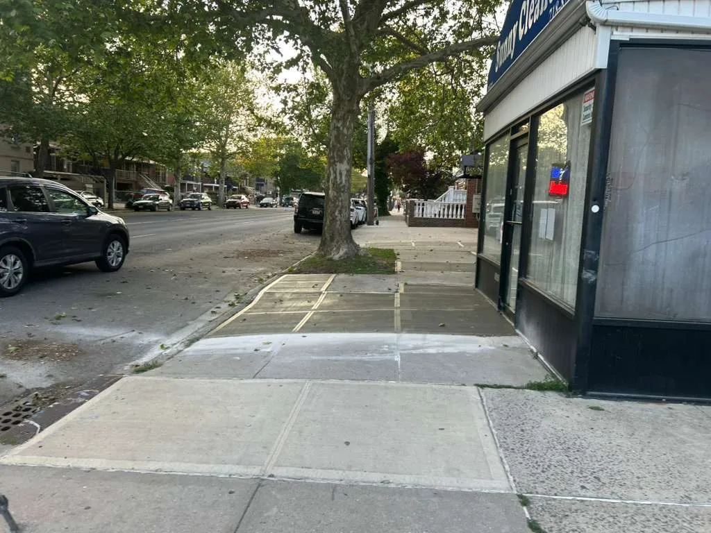 Rebuilt sidewalk along a mixed-use frontage on Williamsbridge Rd in the Bronx